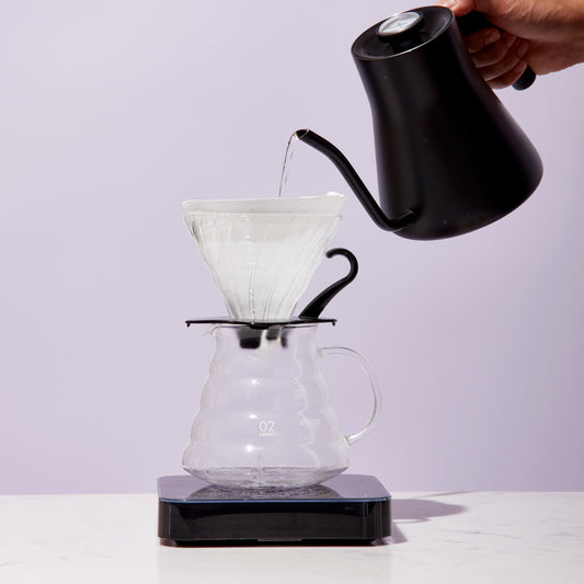 pouring water into chemex