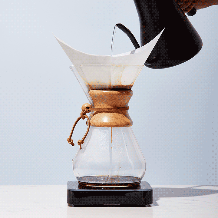 Water is poured over coffee grounds in a Chemex