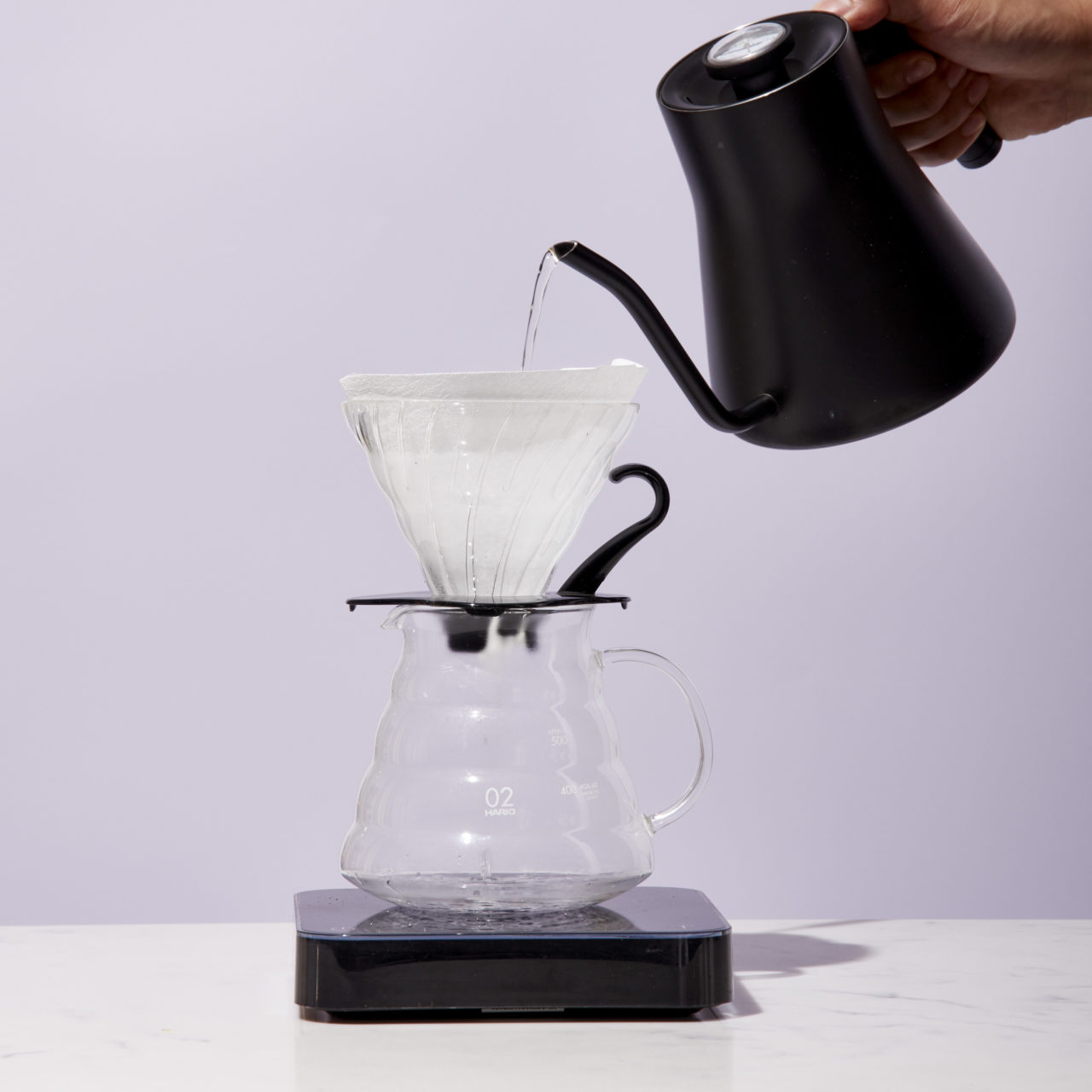 pouring water into chemex
