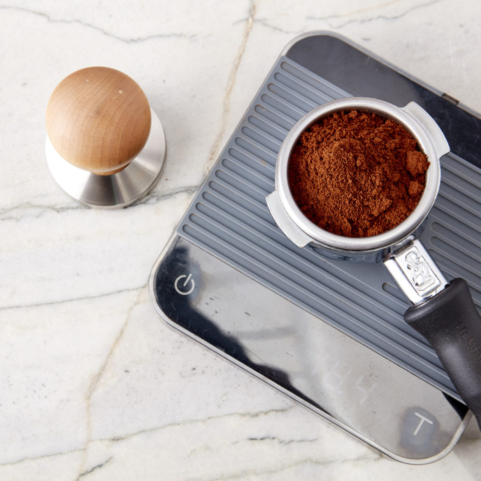 Espresso in a portafilter on a scale