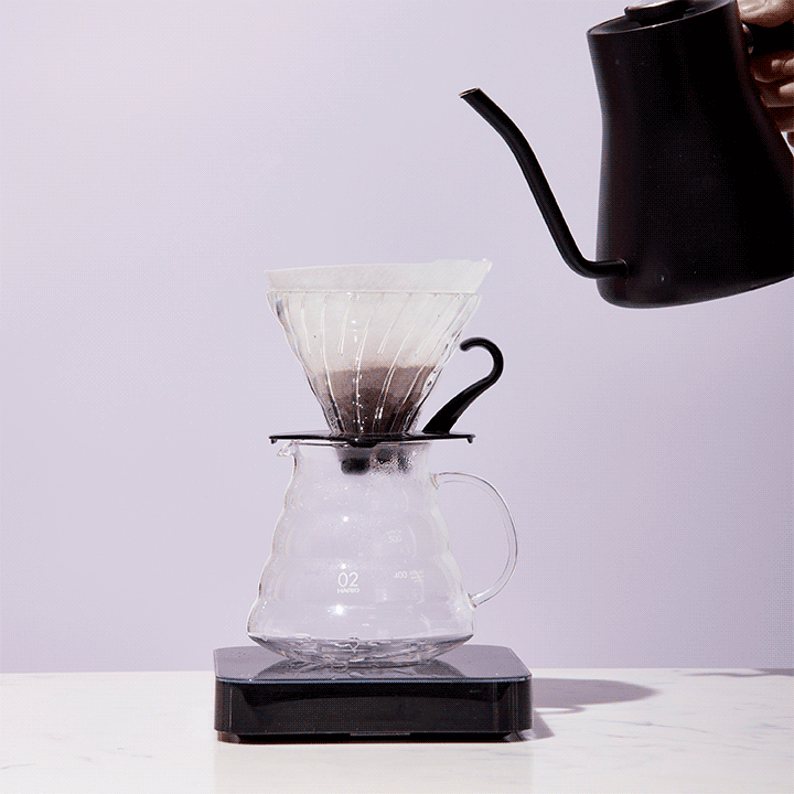 Water saturates coffee grounds in a V60