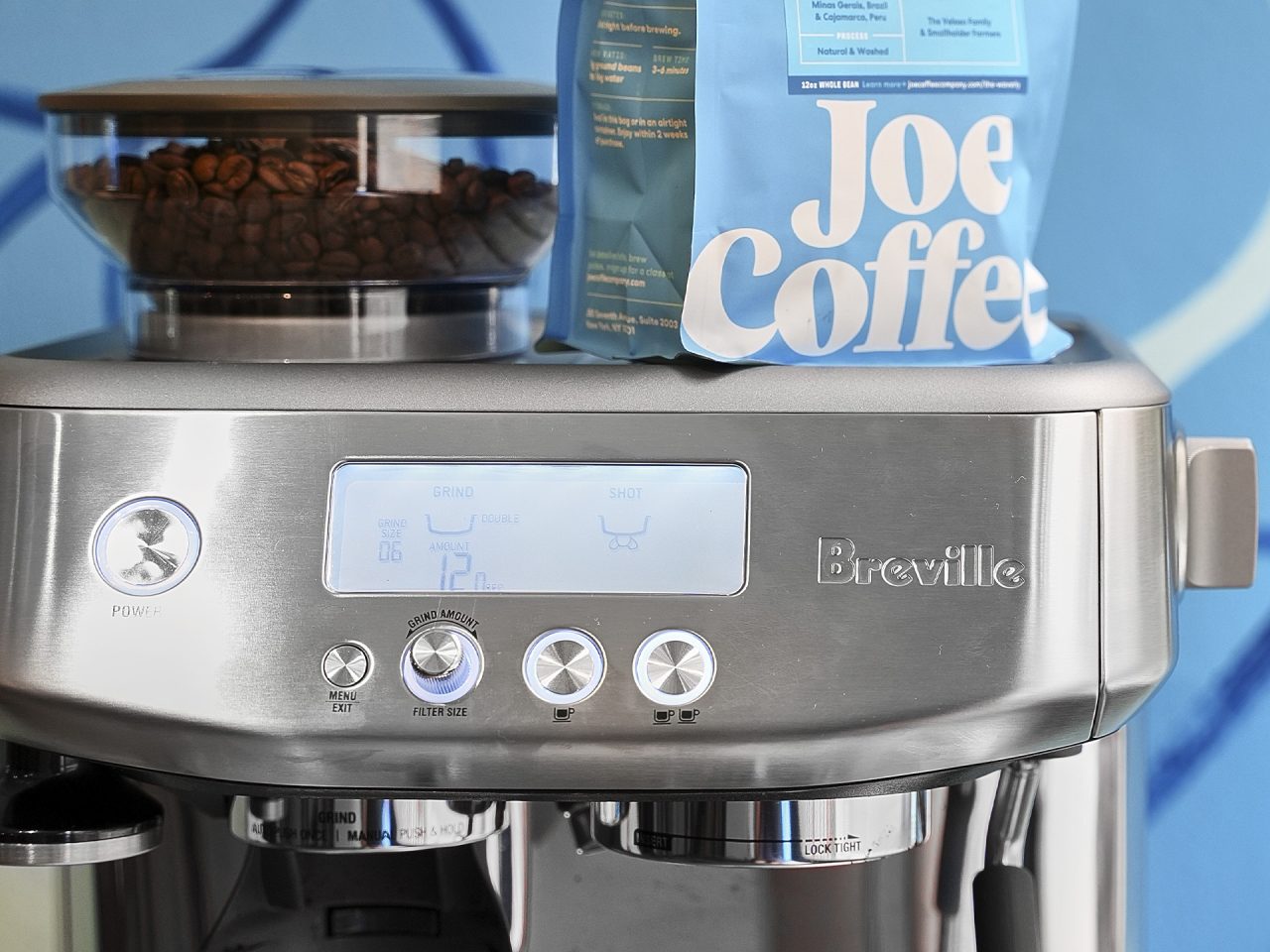 Breville espresso machine with Joe Coffee bag on top