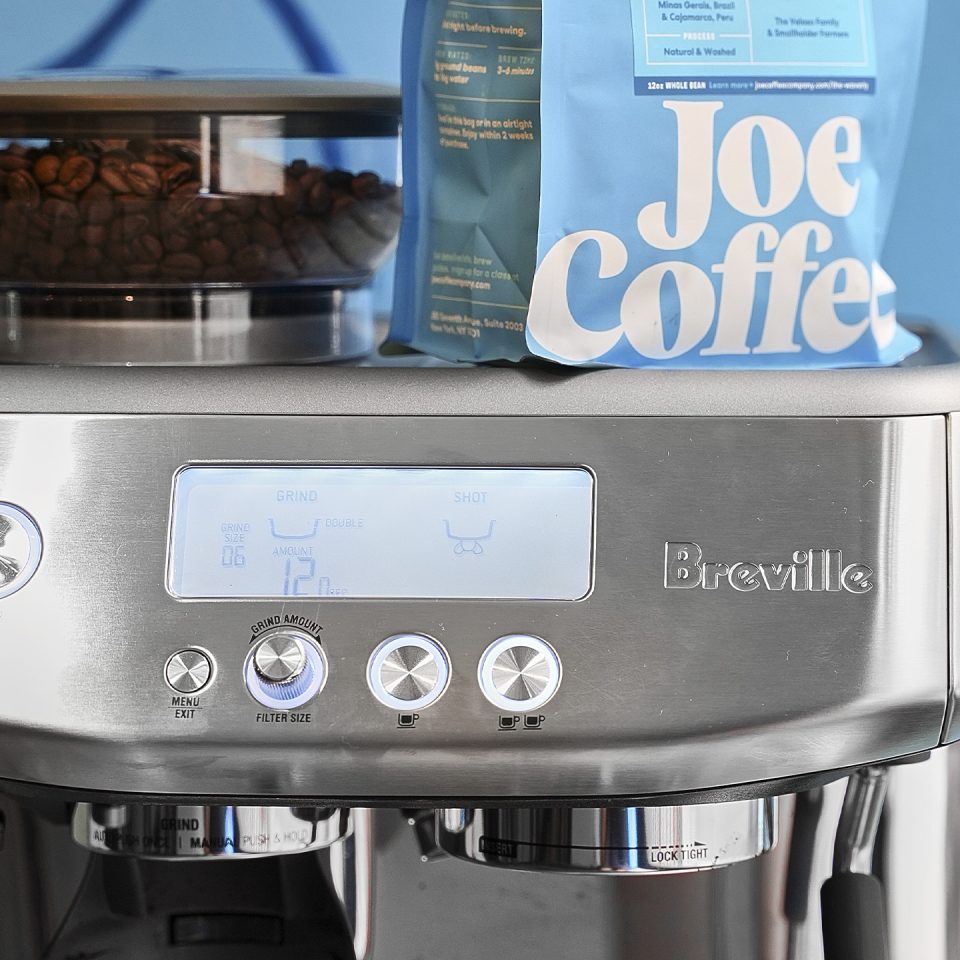 Breville espresso machine with Joe Coffee bag on top