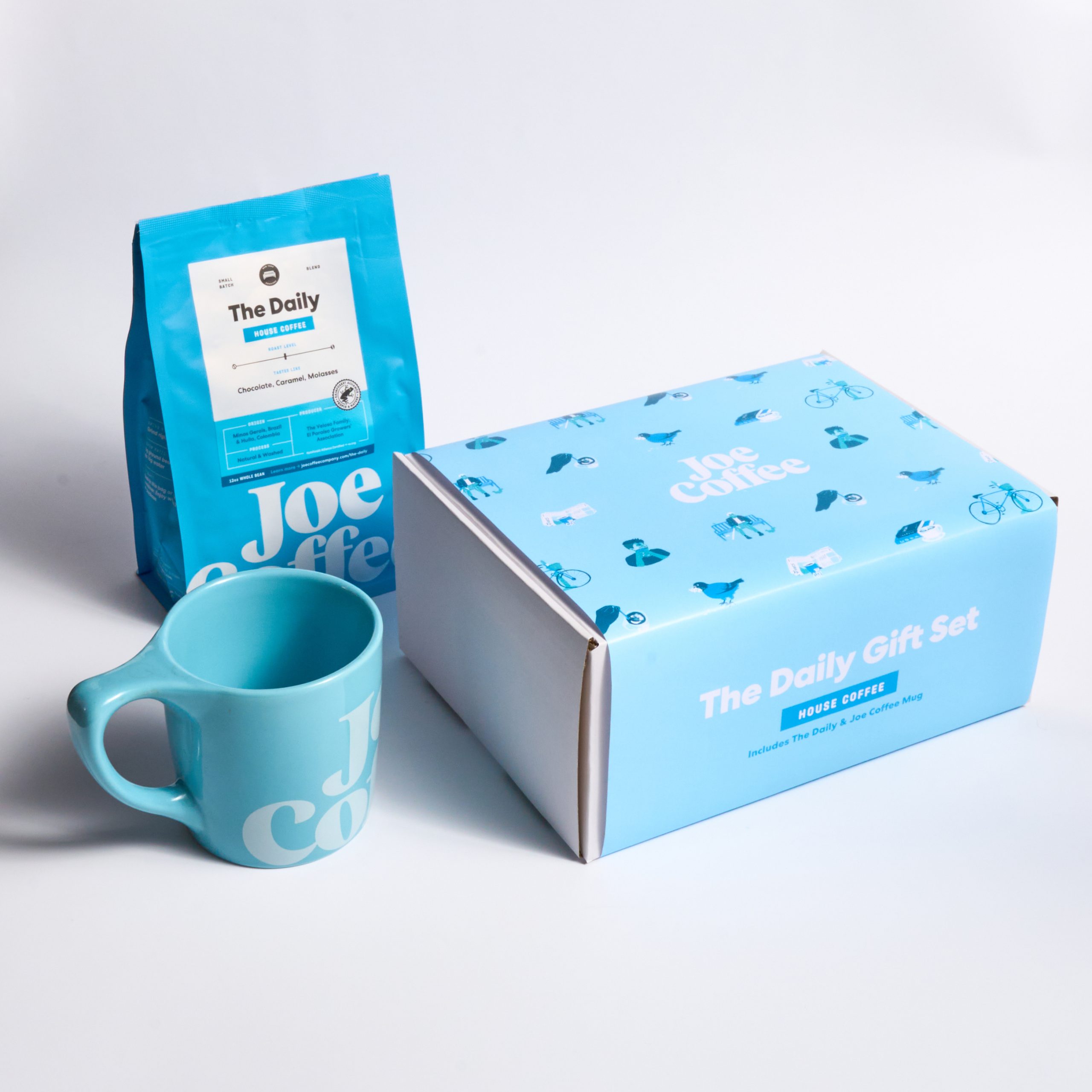 The Daily Gift Set pictured with a bag of The Daily and a Joe Coffee mug