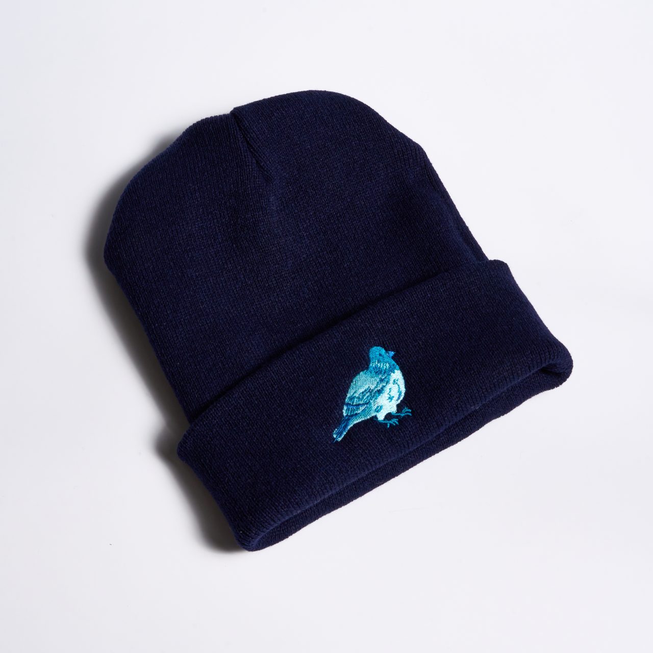 Navy blue beanie with pigeon embroidery