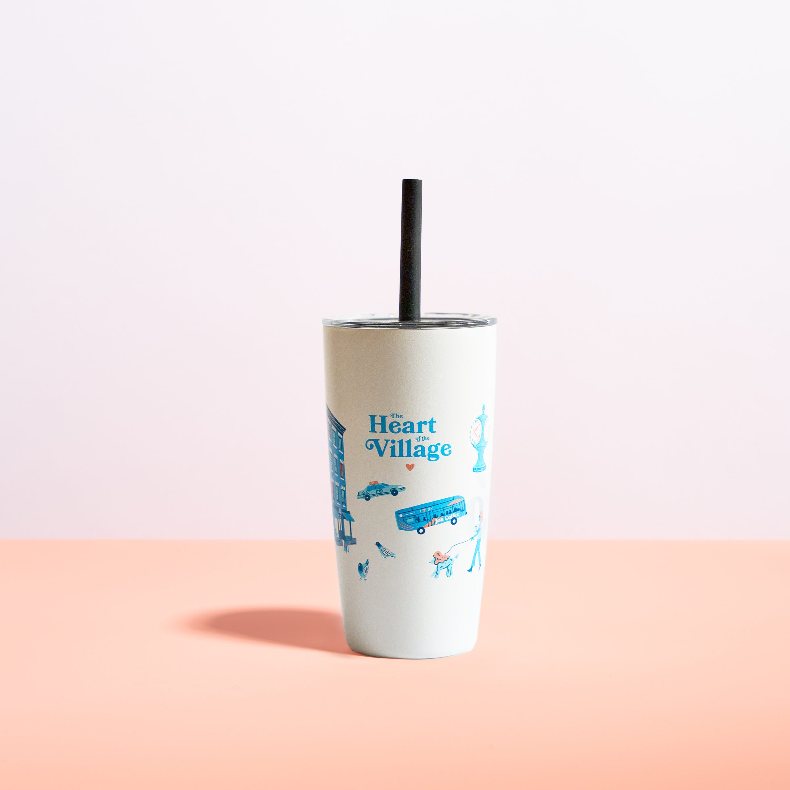 white tumbler that has blue and orange illustrations, with a black straw
